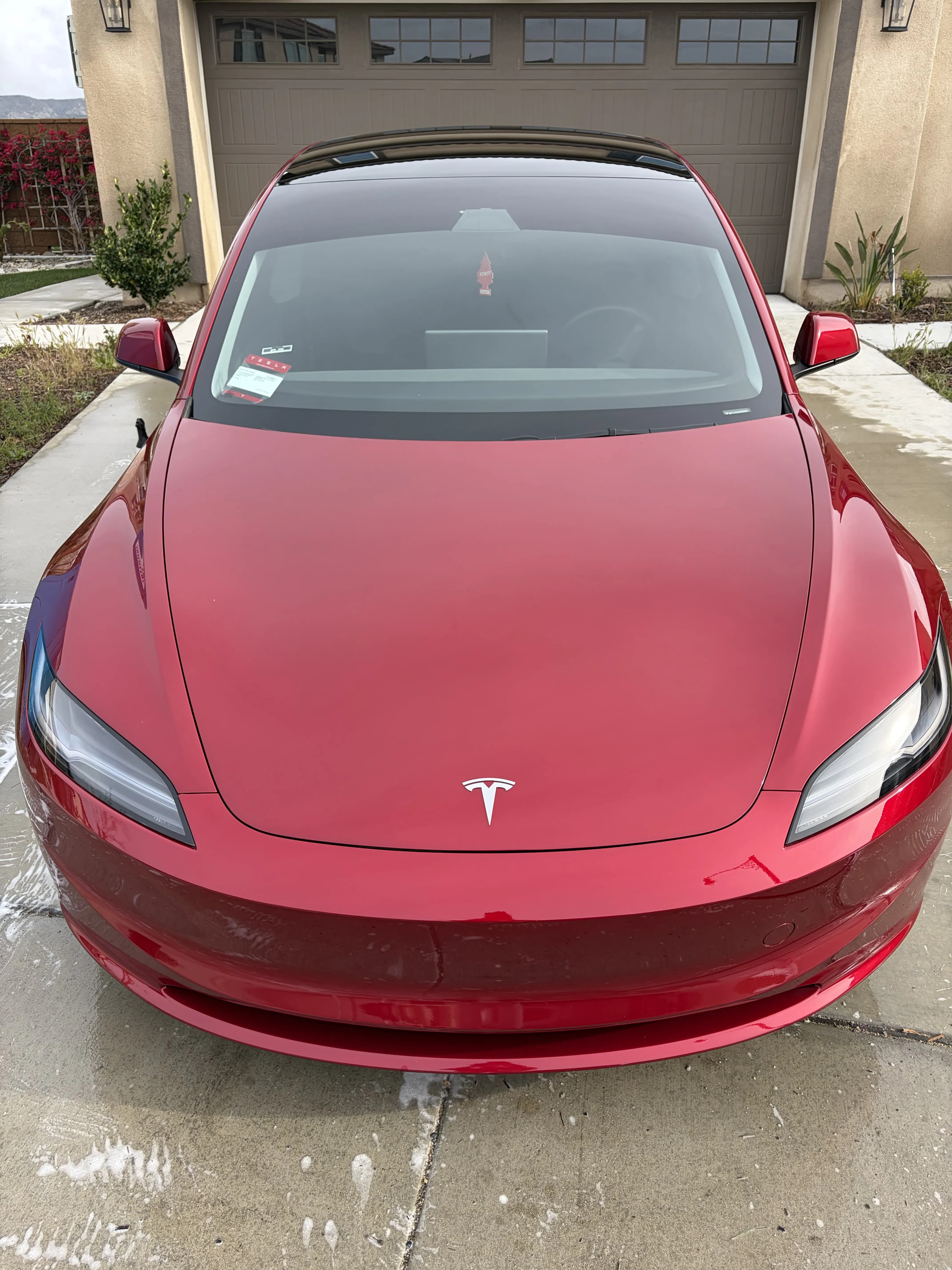 Red Tesla Model 3 exterior detail